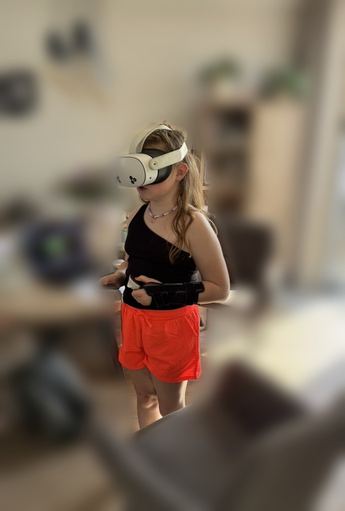 A child wearing a Meta Quest headset while trying the experience at home